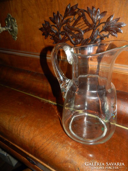 Old glass water jug with flower painting