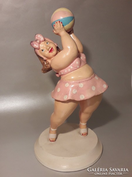 Vintage sculpture of a woman in a bathing suit at the beach on a wooden base