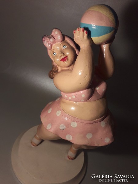 Vintage sculpture of a woman in a bathing suit at the beach on a wooden base