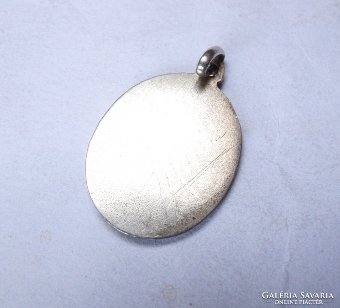 Old silver religious pendant.