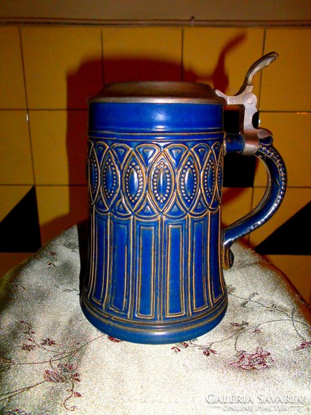 German ceramic jug with tin lid.