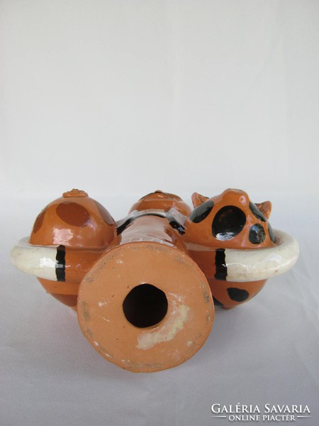 There is a pig... Glazed earthenware ceramic male figure with two little pigs 25 cm