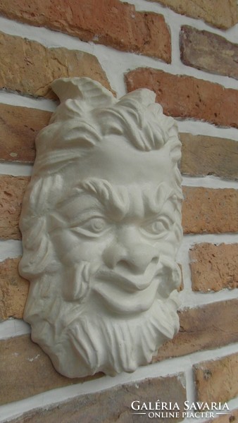 Pan head wall decoration made of artificial stone