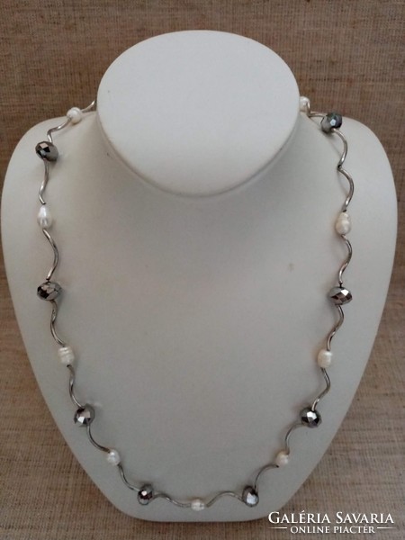 Brand name long steel necklace studded with cultured pearls