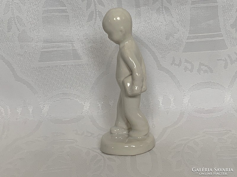 Porcelain boy with book, 13 cm. Unpainted and unmarked