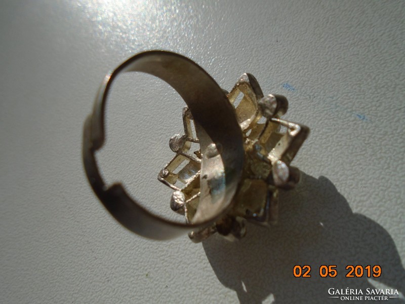 Spectacular, pierced antique ring in the shape of a star with many polished stones and silver
