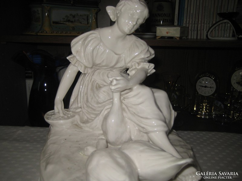 A porcelain girl stuffing a goose, a rare beautiful artefact, probably Bernard Bloch