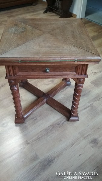 Old coffee table with drawers, with an opening leaf