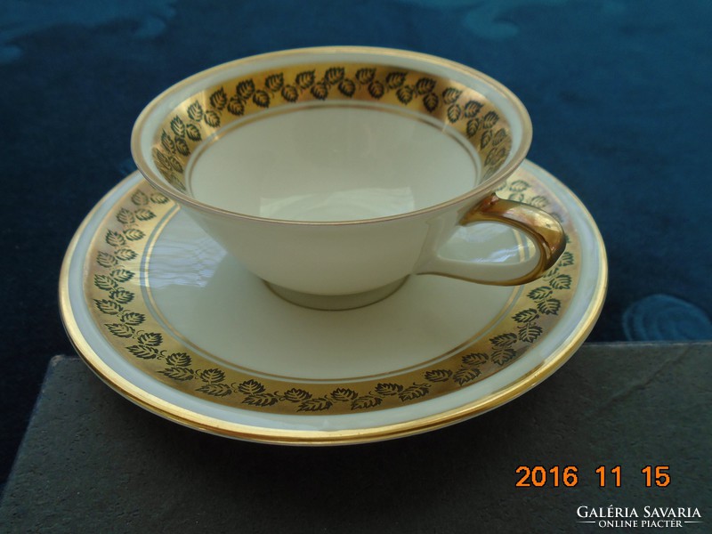 1948 Weimar mocha cup with hand-painted leaf pattern on a gold background