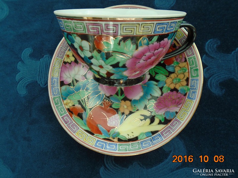 Hand painted gold contoured famille noir mille fleur tea cup with saucer