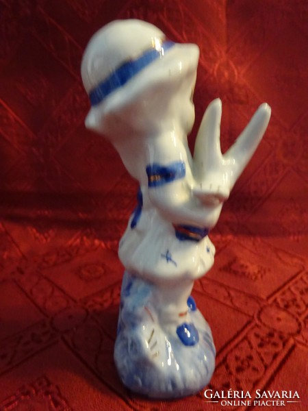 Oriental porcelain figural statue of a little girl with a dog and a pigeon. He has!