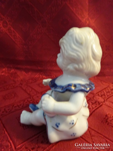 German porcelain figurine, little girl pulling shoes, height 11 cm. He has!
