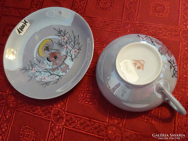 Japanese porcelain teacup + placemat, light blue base. He has!