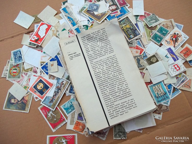Hundreds of stamps + stamp catalog