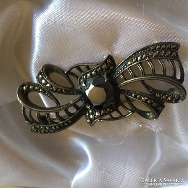Silver badge marked with marcasite and hematite