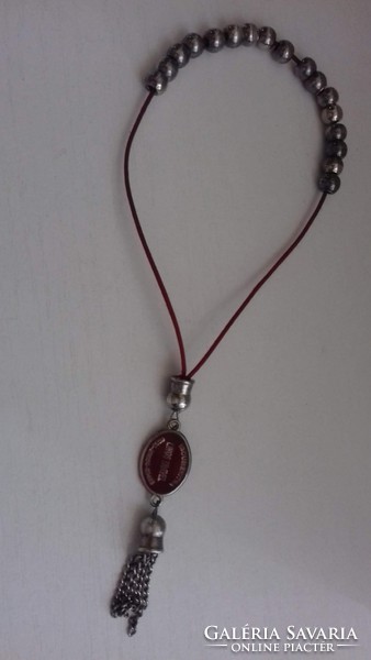 Prayer rosary prayer chain with fire enamel inscription medallion on it.