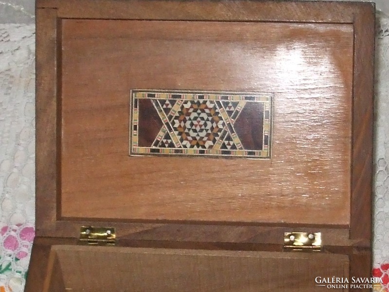 Decorative box with mother-of-pearl coating.