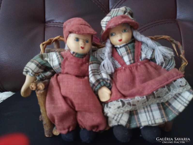 Dutch dolls on a bench and basket