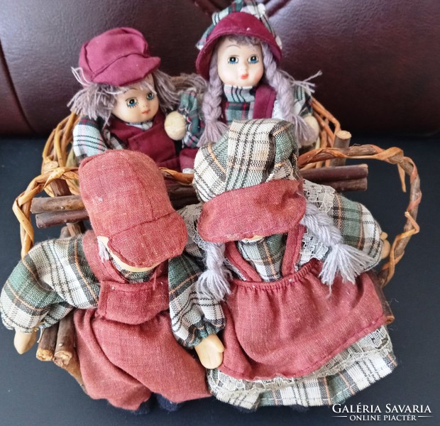 Dutch dolls on a bench and basket