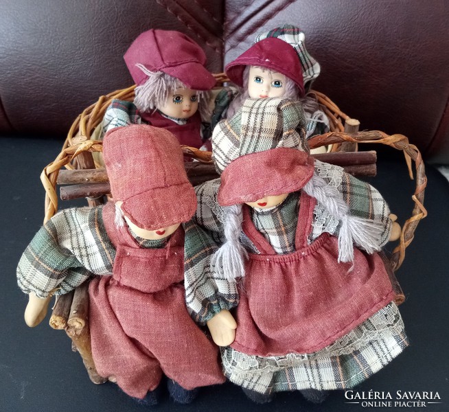 Dutch dolls on a bench and basket
