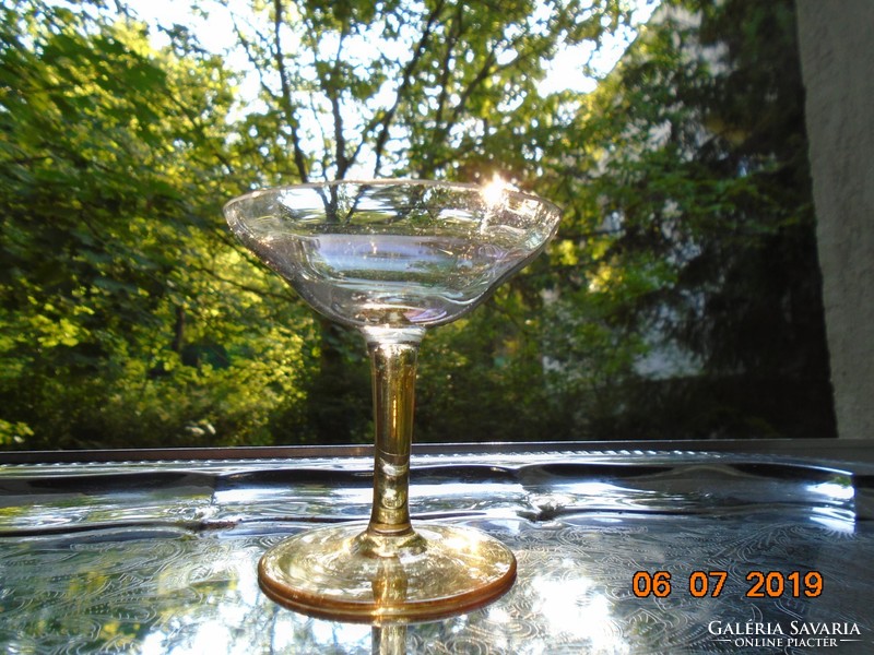 Honey-colored cascading actor, slightly faceted champagne goblet