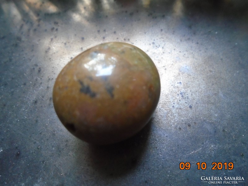 Polished mineral larger pearl