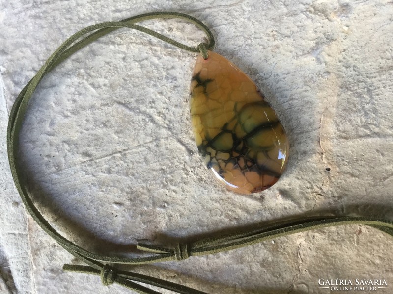Giant agate vein pattern mineral pendant on olive green leather