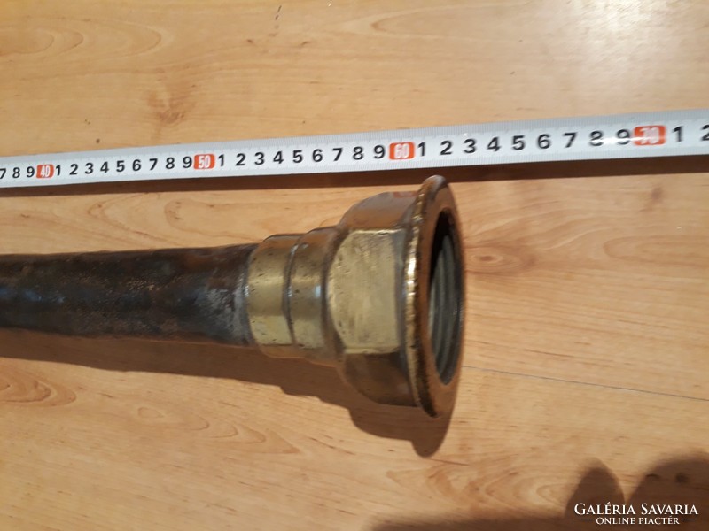 Old yellow and copper fire hose end (approx. 100 years old)