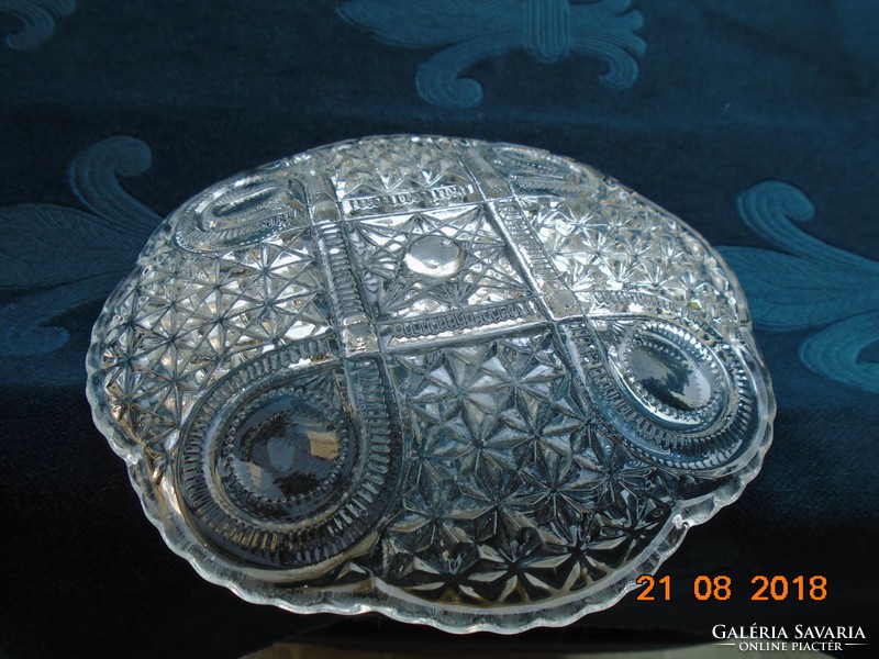 A thick-walled crystal glass offering with very rich polished patterns