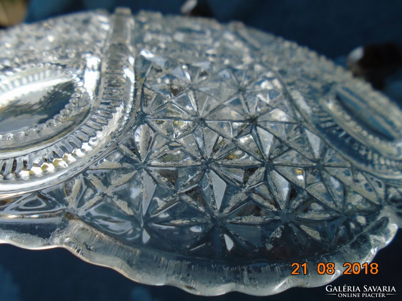 A thick-walled crystal glass offering with very rich polished patterns