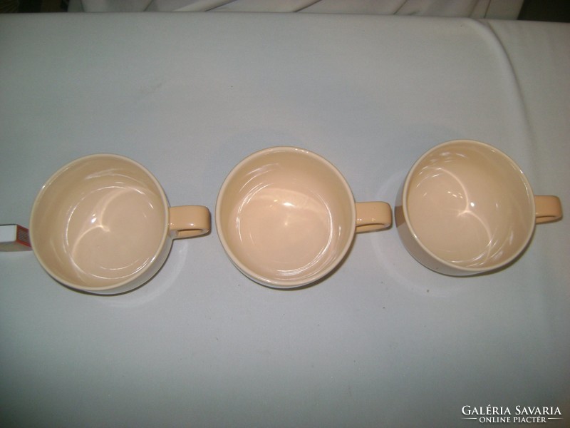 Three vintage soup cups together