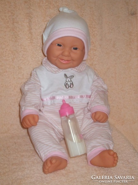 Rare lifelike baby girl with baby bottle..