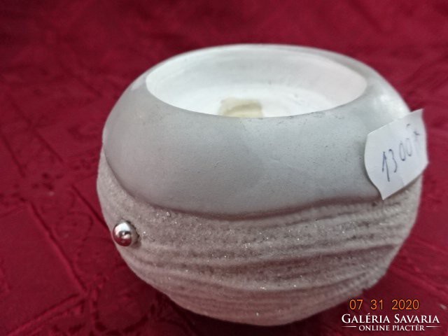 Porcelain candle holder, round, largest diameter 9 cm. He has!