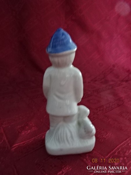 Porcelain figure, boy with dog, height 12.5 cm. He has!