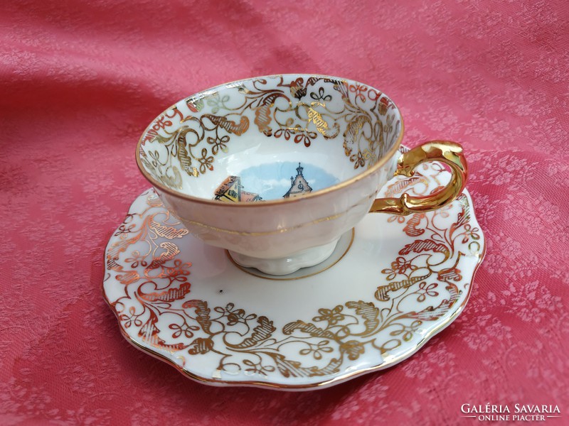 Porcelain coffee cup with saucer decorated with gold