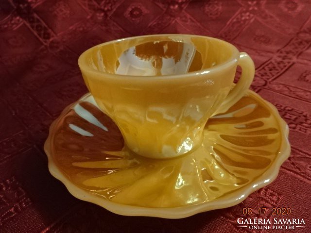 American porcelain coffee cup + saucer, shiny, eggshell color. He has!