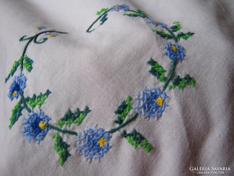 Old embroidered tablecloth with cross-stitch crochet insert