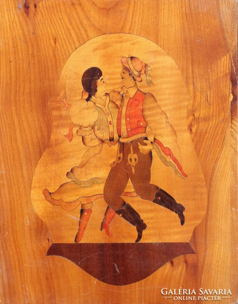 Old, colorful intarsia decoration: self-absorbed dancers