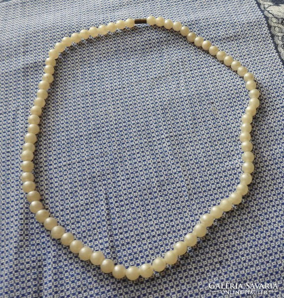 White old plastic string necklace