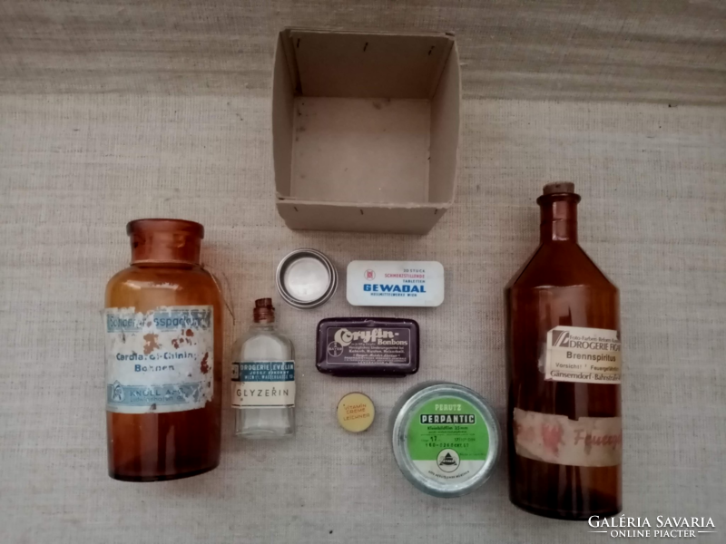Old medicine bottles and boxes are sold together.