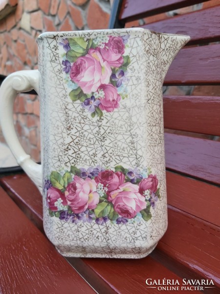 A pink earthenware jug with a beautiful pattern, a piece of nostalgia