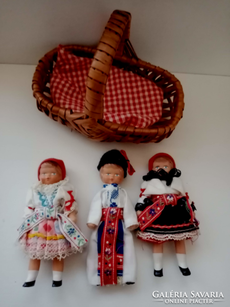 3- Pieces of a small rubber doll in old folk clothes in a small wicker basket for sale together