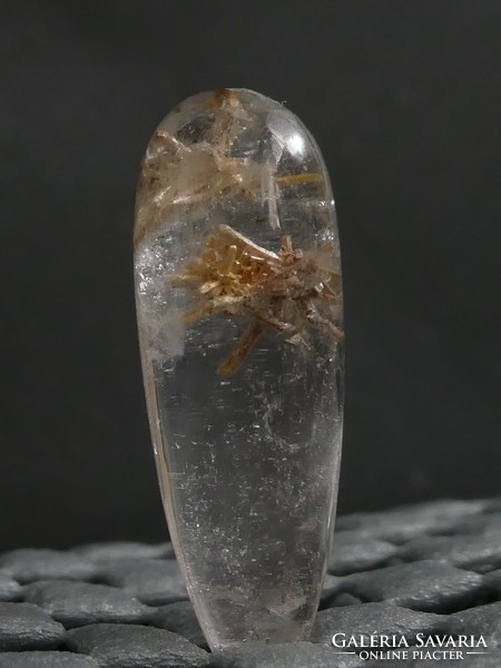 Natural rock crystal with actinolite and chlorite needle inclusions.