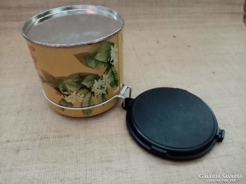 Old marked coffee or tea metal box with a vinyl lid with a snap that can be easily closed