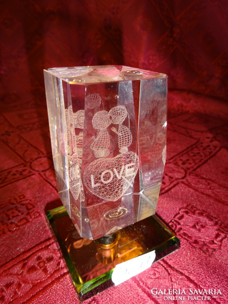 3D laser engraved glass block with the word love. Its height is 8 cm. He has!