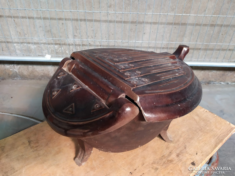 Antique art deco bauhaus enameled charcoal log holder stove charcoal stove next to fireplace