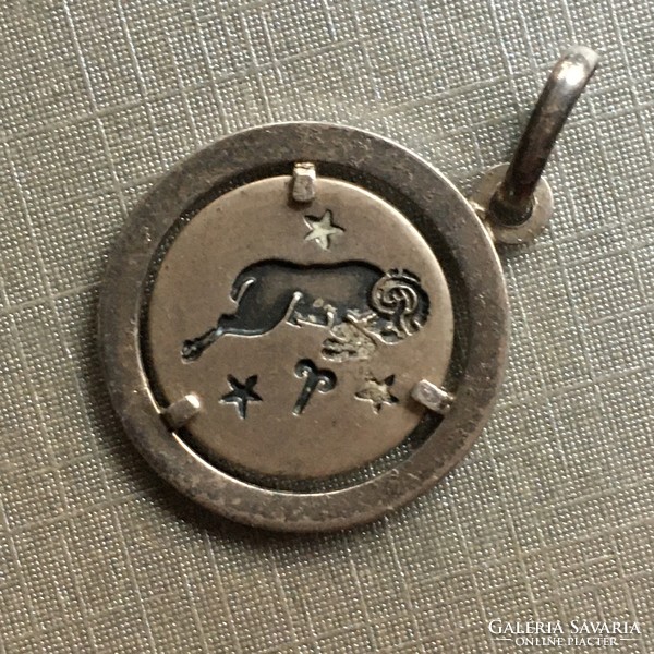 Giampaoli-uno is marked with a silver ram pendant