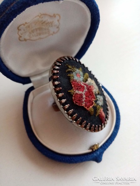 Old ring adorned with embroidered handmade embroidery