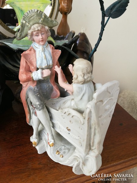 Antique baroque man with doll,