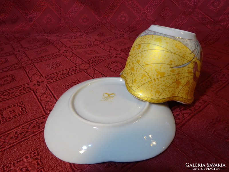 Japanese porcelain tea cup + saucer, rectangular. He has!